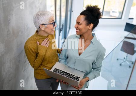 Busy business people, programmers software developer engineer working on computer in office Stock Photo