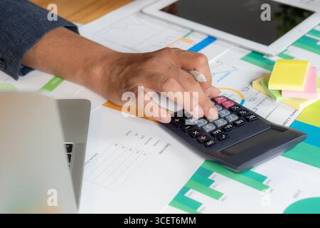 Conceptual image illustrating cost calculation and expense analysis with financial charts, calculator, and documents representing budgeting, planning, Stock Photo