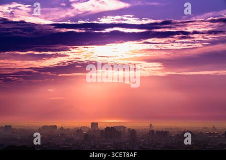 A spectacular sunset paints the sky above Yilan, Taiwan, with vivid streaks of orange and deep purple, creating a breathtaking and dramatic natural di Stock Photo