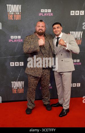 Tommy Fury (left) and Eddie Hall pose for photographs during the press ...
