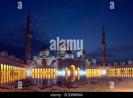 A panoramic view of the inner courtyard of the Sheikh Zayed Grand Mosque in Abu Dhabi, capital city of the United Arab Emirates (UAE). Photographed after sunset. Stock Photo
