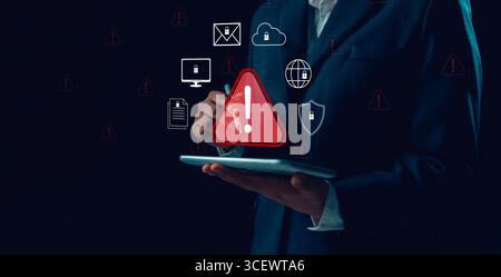 Businesswoman receives cyber security warning alert on smartphone and computer, data vulnerability, compromised information illegal, concept of digita Stock Photo