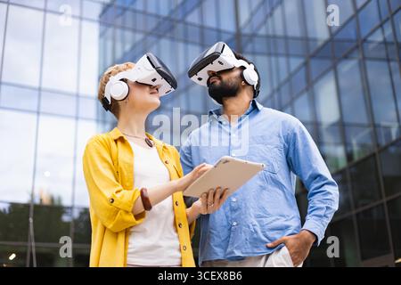 Exploring VR Technology Together Stock Photo