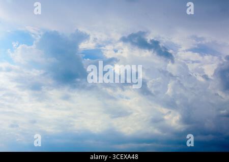 Soft Cloud Layers with Bright Light and Blue Sky Background for Nature and Design Use. Stock Photo