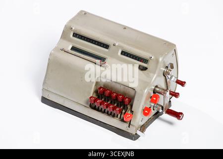 Vintage Old Mechanical Calculator with Classic Design, Retro Buttons and Weathered Surface, Nostalgic Office and Accounting Equipment Stock Photo