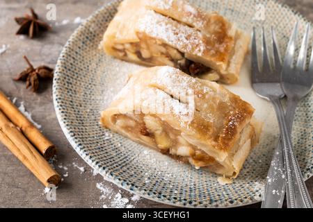 Homemade apple strudel on white marble background. Traditional Austrian and German sweet Stock Photo