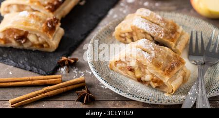 Homemade apple strudel on white marble background. Traditional Austrian and German sweet Stock Photo