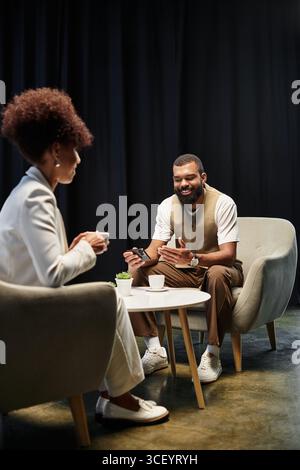 Two young professionals engage in a interview, showcasing their enthusiasm and professionalism. Stock Photo