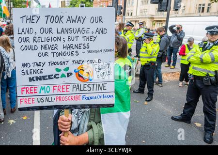 London, UK. 20th Aug, 2025. A rally after the Band had entered the building with speeches and songs - Defend Kneecap protest at Westminster Magistrates' Court. Mo Chara (Liam 'g ' hAnnaidh) of Kneecap faces his second court appearance over an alleged offence under the Terrorism Act for displaying a flag in support of the proscribed organisation Hezbollah at a concert in London in November 2024. Credit: Guy Bell/Alamy Live News Stock Photo