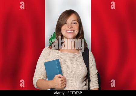 Happy woman student against Peruvian flag background. Travel, education and learn languge in Peru concept Stock Photo