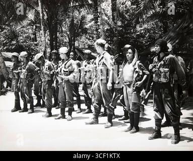 A historical photograph of Australian Army soldiers marching along ...