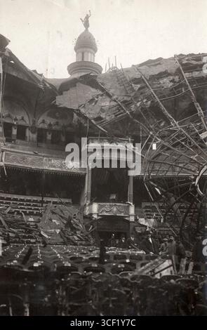 In 1913, the Hippodrome Theatre in Antwerp, Belgium, was severely damaged by fire. The heavily destroyed remains of the building are visible, a day after the fire. Stock Photo