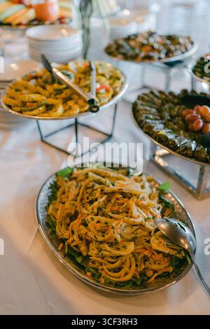 Delicious Mediterranean buffet featuring various dishes at a festive gathering Stock Photo