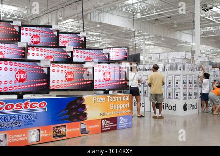 Large flat panel televisions on display at a Costco Warehouse. Costco ...