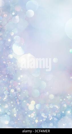 Sparkling glitter in soft, light blue colors. Dreamy shimmering particles glowing softly in a blurry bokeh of white and blue lights. Dreamlike blurred Stock Photo