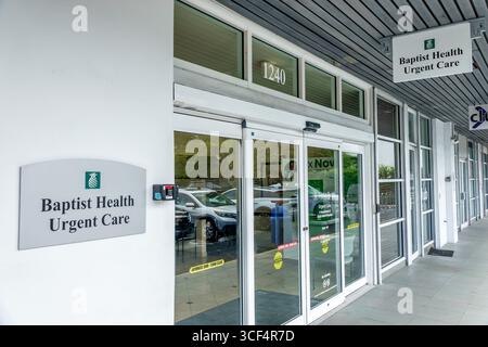 Coral Gables Miami Florida,Baptist Health Urgent Care,medical clinic healthcare facility,exterior building entrance,glass sliding doors automatic,sign Stock Photo