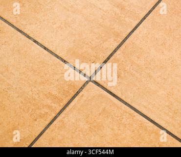 Brown ceramic floor tiles close up texture. Stock Photo