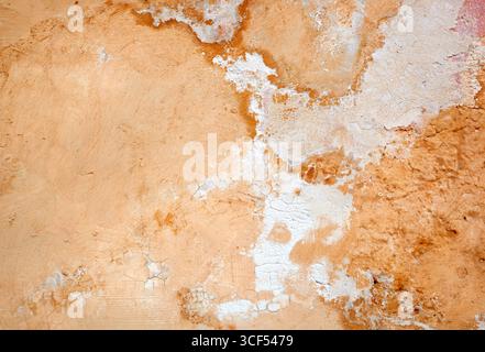 Cracked and peeling paint and grunge old wall with texture. Stock Photo