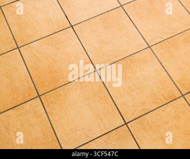 Brown ceramic floor tiles close up texture. Stock Photo