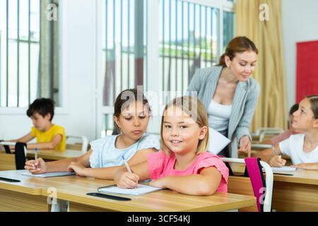 Kid cheating during test Stock Photo
