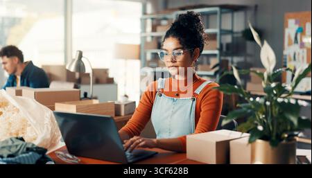 Office, logistics and woman typing on laptop for stock, inventory management and procurement email. Computer, worker and online for shipping with Stock Photo