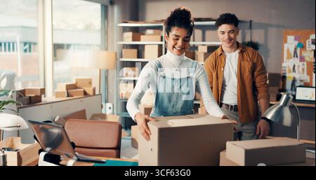 Woman, man and box for delivery in office, order or supply chain with team for shipping small business. Distribution, parcel or package with people Stock Photo