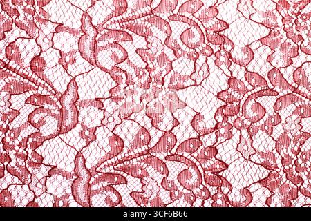 A close-up of the red brocade fabric used to make Javanese kebaya or blouses. Stock Photo