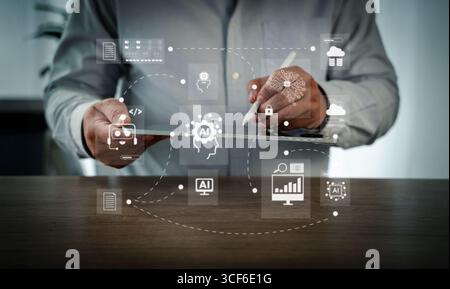 User flowchart, cloud computing, and AI integration visualized on a modern computer screen, showing a person analyzing business processes and data in Stock Photo