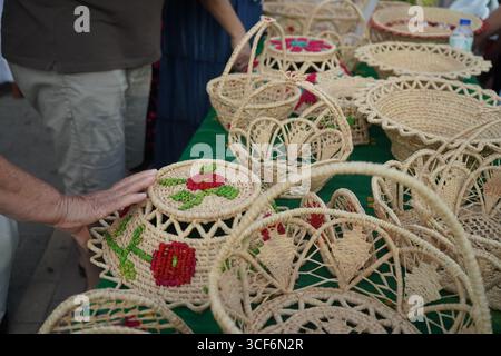 Traditional Cretan handmade baskets with intricate geometric patterns and earthy tones, a symbol of local craftsmanship and authentic folk art. Stock Photo