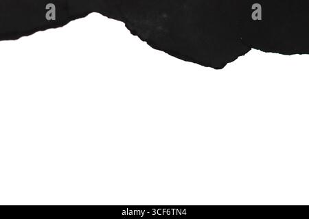 Torn black paper on a white background. Stock Photo