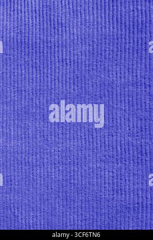 Close-up of blue corduroy trousers pants fabric background backdrop. Traditional fashion garment fabric concept. Stock Photo