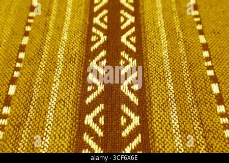 Closeup of Texture and Pattern of Classy Yellow and Brown Thai Northern Region's Traditional Textile Stock Photo