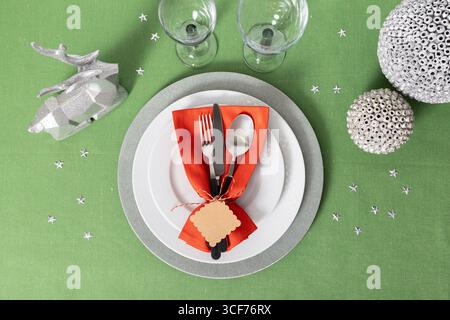 Minimalist flat lay showcasing a modern Christmas tablescape complete with stylish cutlery and plates Stock Photo