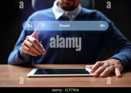 Man interacts with tablet using innovative technology during evening work session Stock Photo
