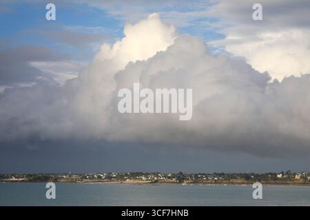 Coast of french Brittany under the huge cumulus clouds Stock Photo