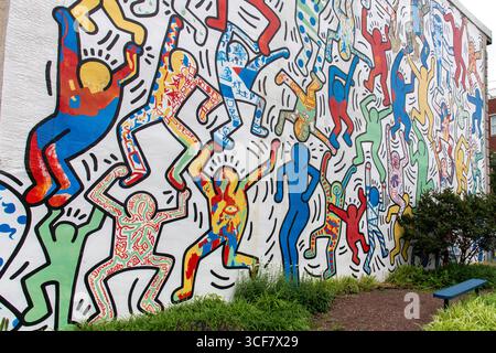 Philadelphia, PA, USA-June 17, 2025; Mural We the Youth by Keith Haring in Point Breeze painted in 1987 with high school students with full restoratio Stock Photo