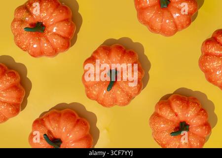 Autumn pumpkins pattern on yellow background Stock Photo