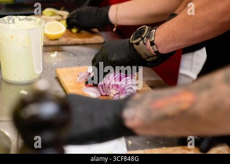 slicing onions into half rings Stock Photo