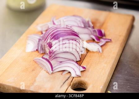 slicing onions into half rings Stock Photo