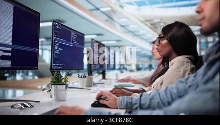 Corporate Analyst Group Analyzing KPIs In American African Classroom Stock Photo
