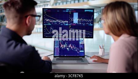 Financial Expert Analyzing Market Data For Online Trading On Computer. Stock Photo