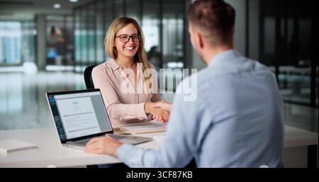 HR Consultant Shaking Hands With Customer Service Staff During Interview Stock Photo