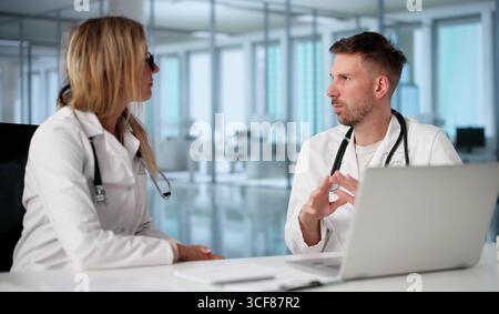 In A Hospital, Two Doctors Engage In A Job Interview. Stock Photo