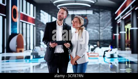 Hospitality Executive Welcoming New Employee To Hotel's Concierge Service Stock Photo