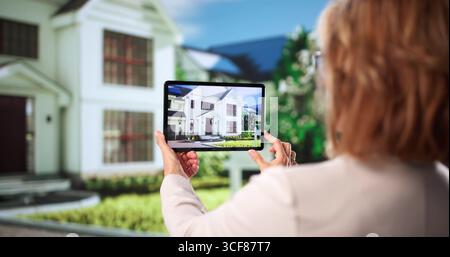 Virtual Real Estate House Video Conference Tour: A Woman Working Stock Photo