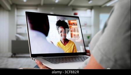 Woman Working As Online Movie Manager On Laptop From Home. Stock Photo