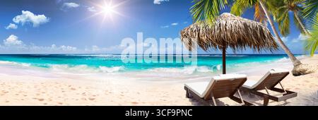 Tropical Palm Beach With Chairs And Straw Umbrella - Maldives Idyllic Island Stock Photo