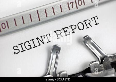 Signals intelligence (acronym SIGINT) report text macro closeup, typewriter typed encrypted electronic communications interception reporting concept Stock Photo