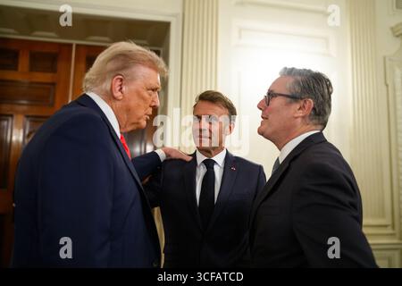 President Donald Trump speaks with French President Emmanuel Macron and U.K. Prime Minister Keir Starmer before their multilateral meeting, Monday, August 18, 2025, in the State Dining Room of the White House. (Official White House Photo by Daniel Torok) Stock Photo