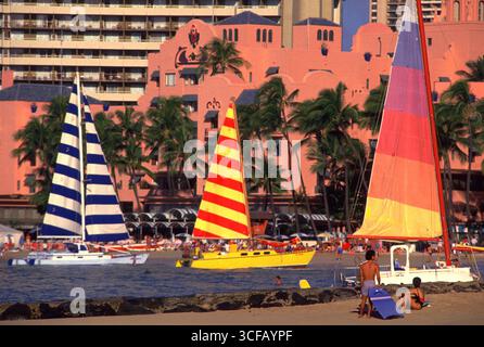 Colorful sails of sailboats on the beach at Waikiki, Honolulu, Oahu, USA Stock Photo